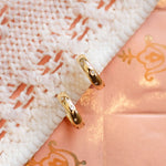 Load image into Gallery viewer, Close-up of a pink fabric with gold embroidery and lace detailing
