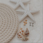 Load image into Gallery viewer, Sun earrings on a textured surface
