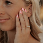 Load image into Gallery viewer, Close-up of a woman with blonde hair touching her ear, wearing a ring.
