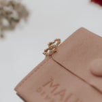 Load image into Gallery viewer, Close-up of a pink leather pouch with 'MAUVE' branding on a light background.
