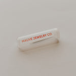 MAUVE JEWELRY CO. branded jewelry box on a neutral background